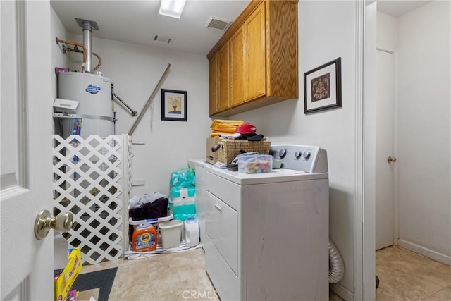 3110 Mckee Rd, Merced, CA 95340 - clothes washing area featuring cabinet space, gas water heater, and light tile patterned floors