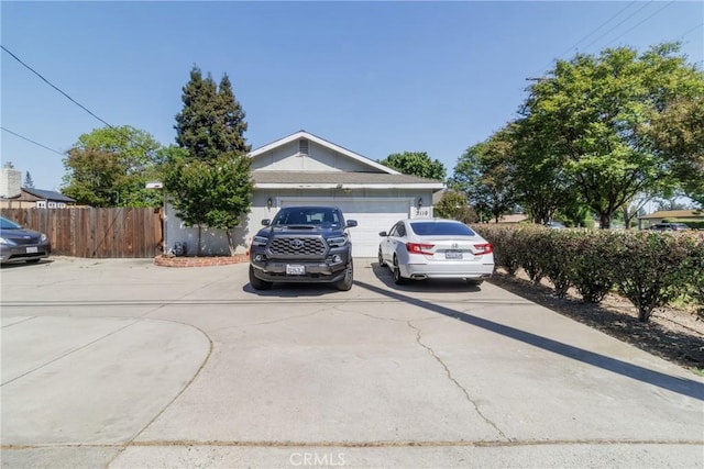 3110 Mckee Rd, Merced, CA 95340 - view of front of home with driveway, fence, and a garage