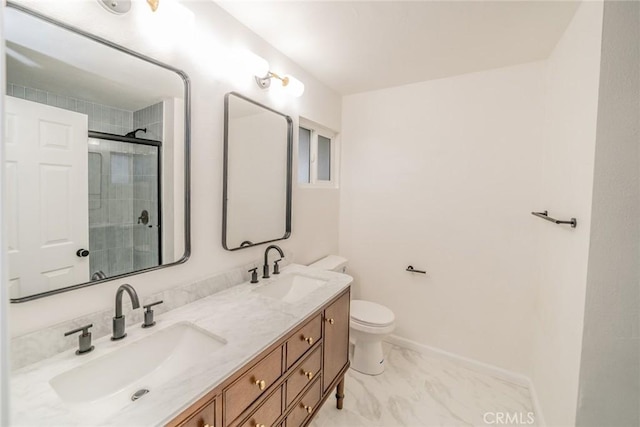 bathroom featuring baseboards, a sink, double vanity, and a stall shower