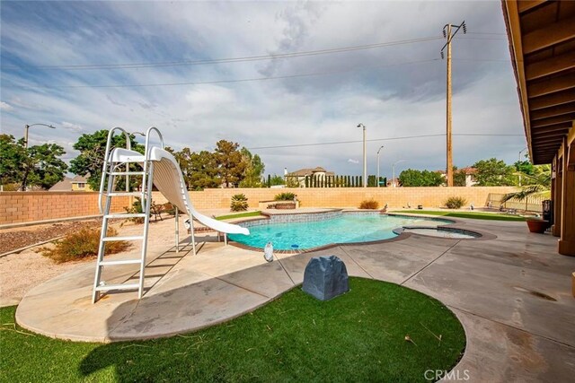 39356 Nicole Dr, Palmdale, CA 93551 - view of swimming pool with a fenced backyard, a water slide, a patio area, an in ground hot tub, and a fenced in pool
