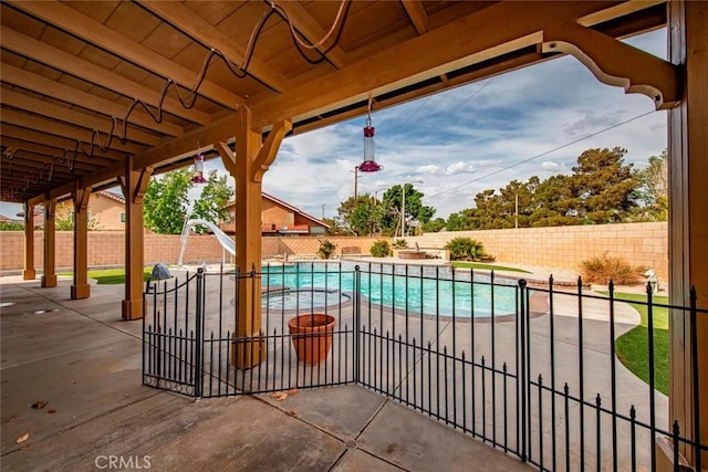 39356 Nicole Dr, Palmdale, CA 93551 - view of swimming pool with a patio area, a water slide, and a fenced backyard