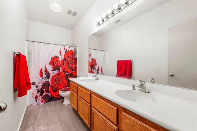 39356 Nicole Dr, Palmdale, CA 93551 - full bathroom with wood finished floors, a sink, and visible vents