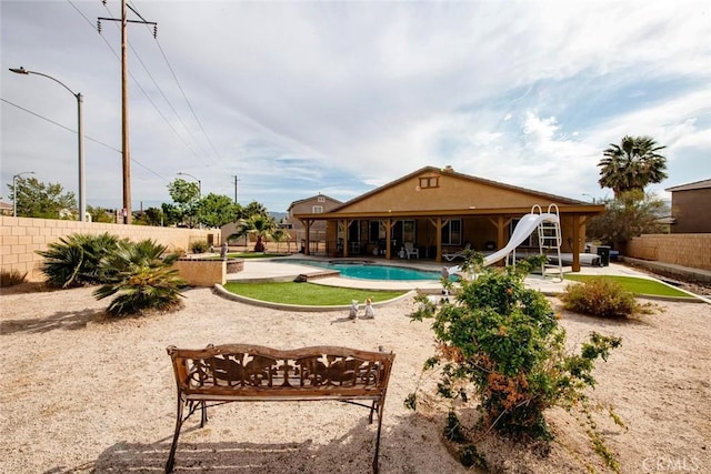 39356 Nicole Dr, Palmdale, CA 93551 - view of pool with a fenced in pool, a patio, a fenced backyard, and a water slide