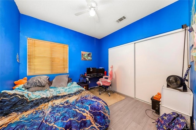 39356 Nicole Dr, Palmdale, CA 93551 - bedroom with wood finished floors, ceiling fan, a closet, and visible vents