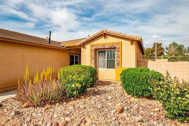 39356 Nicole Dr, Palmdale, CA 93551 - view of exterior entry with fence and stucco siding