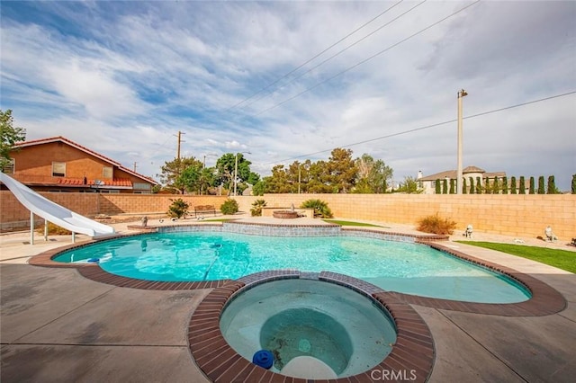 39356 Nicole Dr, Palmdale, CA 93551 - view of pool with a pool with connected hot tub, a fenced backyard, a water slide, and a patio area