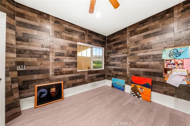 39356 Nicole Dr, Palmdale, CA 93551 - interior space with wood walls, a ceiling fan, and wood finished floors