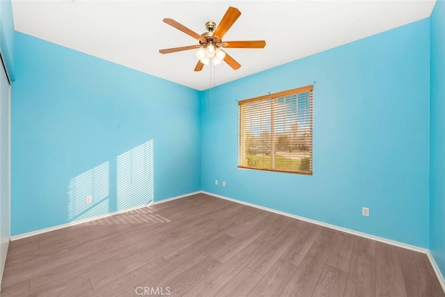 39356 Nicole Dr, Palmdale, CA 93551 - spare room featuring ceiling fan, wood finished floors, and baseboards