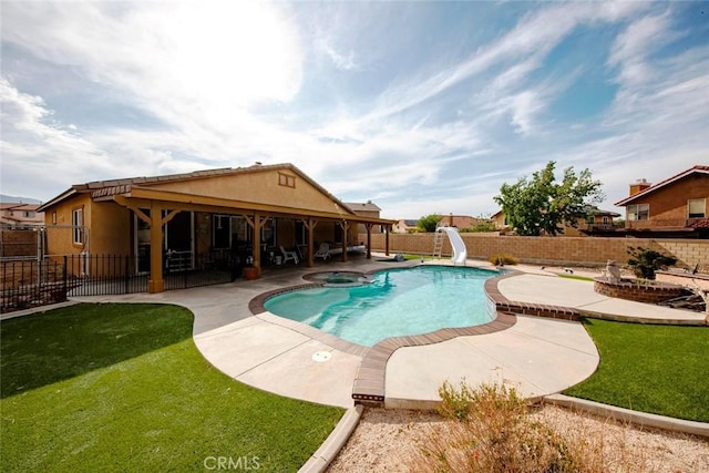 39356 Nicole Dr, Palmdale, CA 93551 - view of swimming pool with a yard, a patio area, a water slide, and a fenced backyard