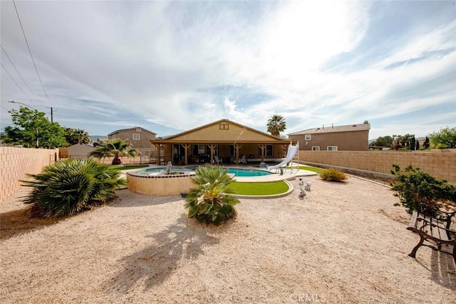 39356 Nicole Dr, Palmdale, CA 93551 - rear view of house with a patio area, a fenced backyard, an in ground hot tub, and a fenced in pool