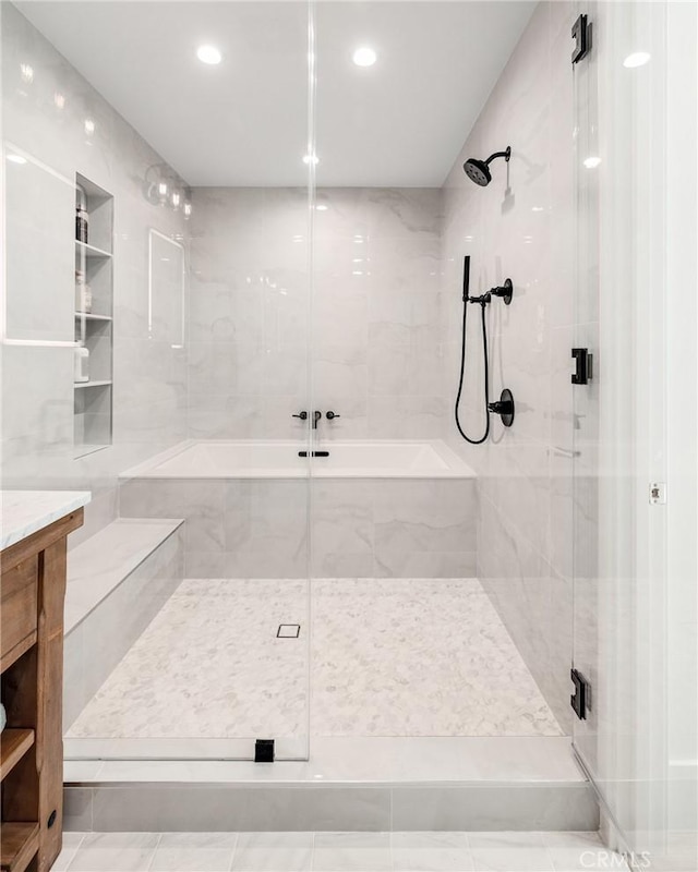 full bath featuring recessed lighting and a shower stall