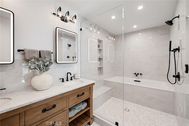full bathroom with a shower stall, decorative backsplash, a sink, and double vanity