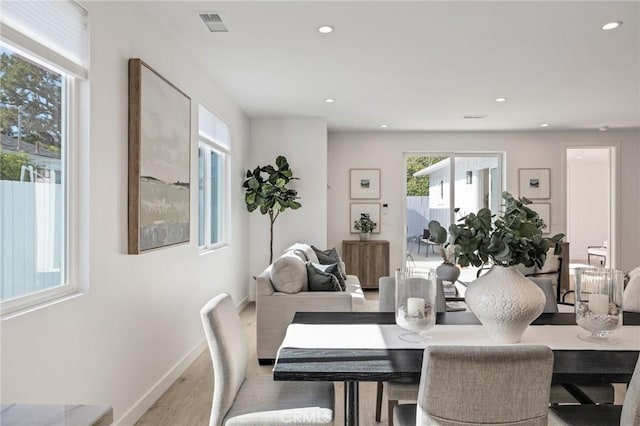 dining space featuring recessed lighting, wood finished floors, visible vents, and baseboards