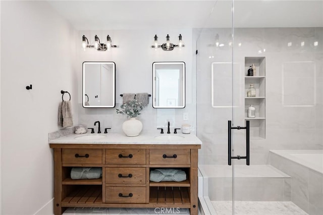 bathroom with a sink, a shower stall, double vanity, and a bathtub