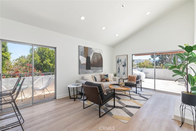 280 S Avenida Caballeros Unit 271, Palm Springs, CA 92262 - living room with light wood-type flooring, recessed lighting, and high vaulted ceiling