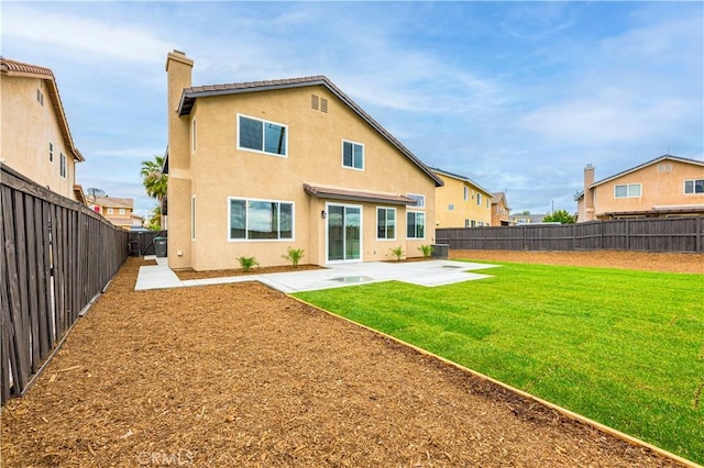 29605 Camino Cristal, Menifee, CA 92584 - rear view of property with a patio area, a lawn, a chimney, a fenced backyard, and stucco siding