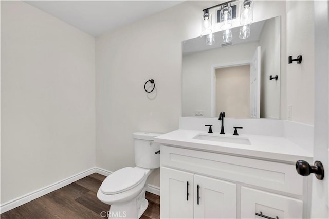 29605 Camino Cristal, Menifee, CA 92584 - bathroom featuring baseboards, wood finished floors, vanity, and toilet