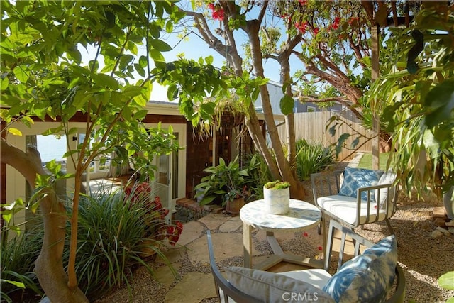 view of patio featuring fence
