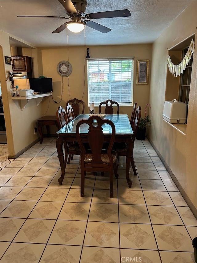 1214 E St, Corona, CA 92882 - dining area with baseboards, a textured ceiling, ceiling fan, and light tile patterned flooring