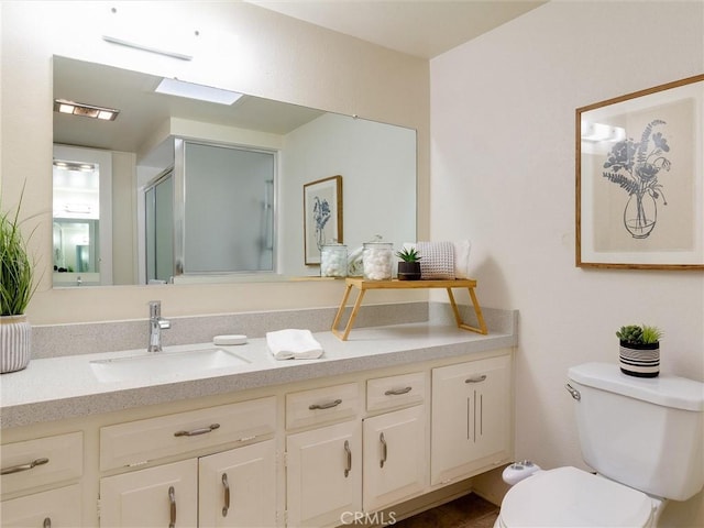 13061 Oak Hill Dr Unit 221B, Seal Beach, CA 90740 - full bathroom featuring an enclosed shower, toilet, and vanity