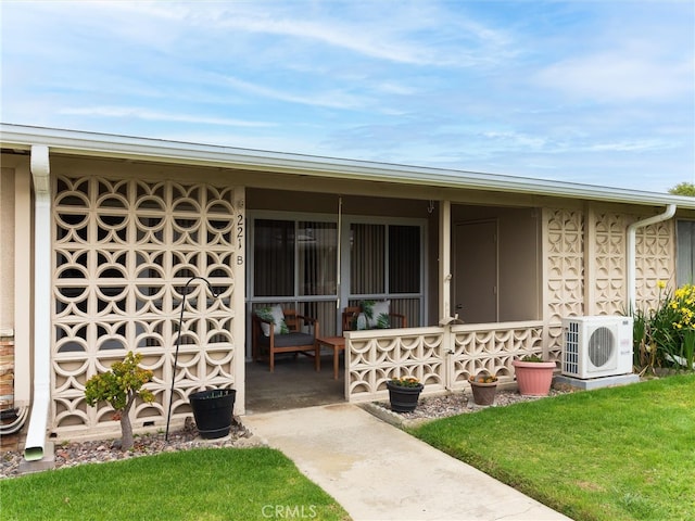13061 Oak Hill Dr Unit 221B, Seal Beach, CA 90740 - exterior space featuring ac unit, a lawn, and a porch
