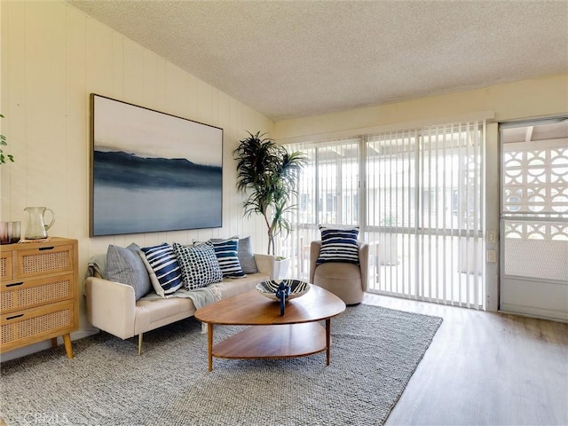 13061 Oak Hill Dr Unit 221B, Seal Beach, CA 90740 - living room with wood finished floors and a textured ceiling