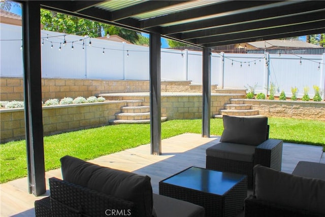 view of patio / terrace featuring a fenced backyard and an outdoor living space