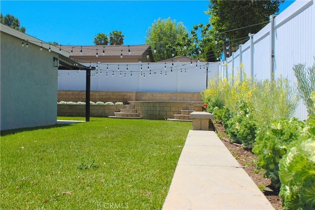 view of yard with a fenced backyard