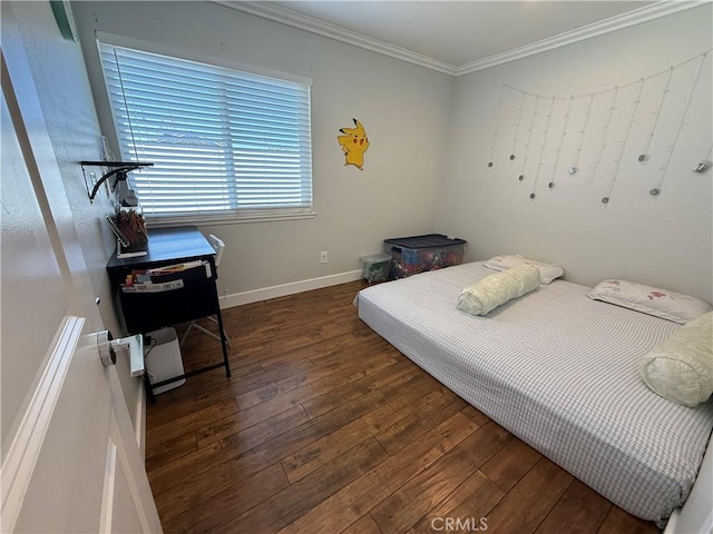 bedroom with baseboards, ornamental molding, and hardwood / wood-style flooring