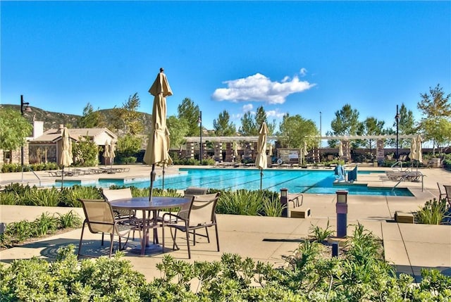 17963 Passionflower Ln, San Bernardino, CA 92407 - community pool featuring a patio