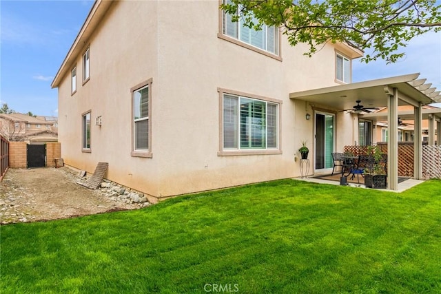 17963 Passionflower Ln, San Bernardino, CA 92407 - back of property featuring a ceiling fan, stucco siding, and a patio