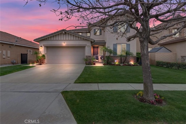 17963 Passionflower Ln, San Bernardino, CA 92407 - view of front of house featuring stucco siding, an attached garage, driveway, and a front lawn