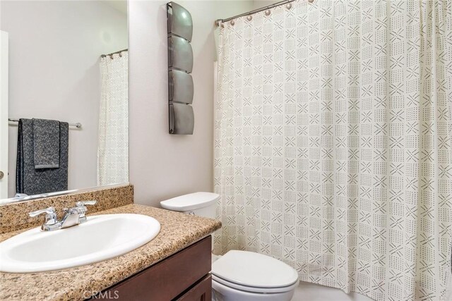 17963 Passionflower Ln, San Bernardino, CA 92407 - bathroom with toilet, vanity, and a shower with shower curtain