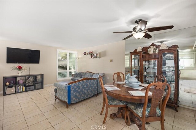 321 Avenida Carmel Unit H, Laguna Woods, CA 92637 - dining space with ceiling fan, baseboards, and light tile patterned flooring