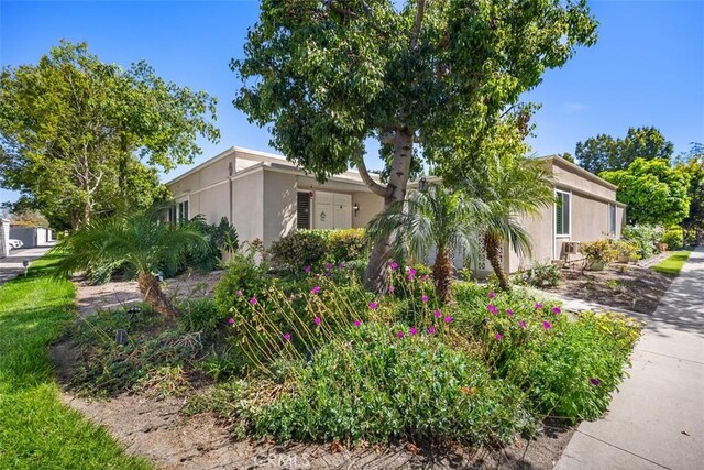 321 Avenida Carmel Unit H, Laguna Woods, CA 92637 - view of home's exterior with stucco siding