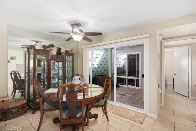 321 Avenida Carmel Unit H, Laguna Woods, CA 92637 - dining room featuring a ceiling fan, baseboards, and light tile patterned flooring