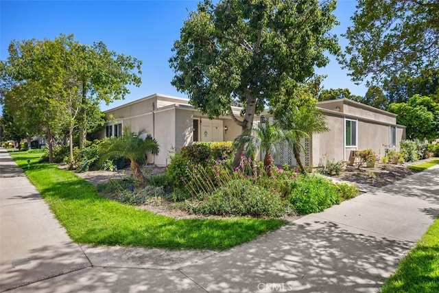 321 Avenida Carmel Unit H, Laguna Woods, CA 92637 - view of home's exterior featuring stucco siding