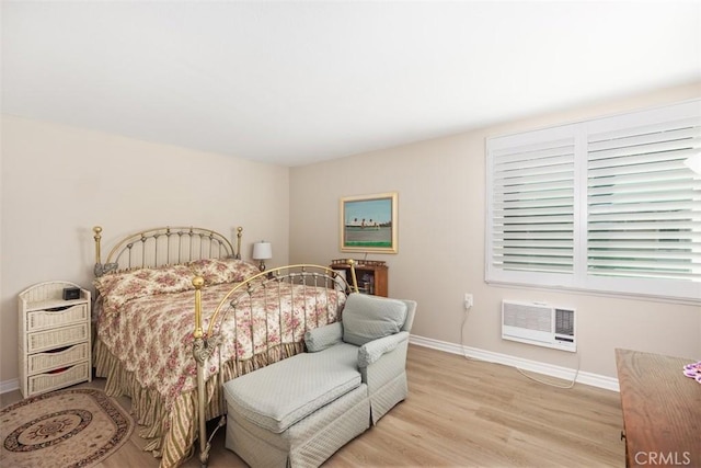 321 Avenida Carmel Unit H, Laguna Woods, CA 92637 - bedroom featuring light wood-style flooring, baseboards, and heating unit