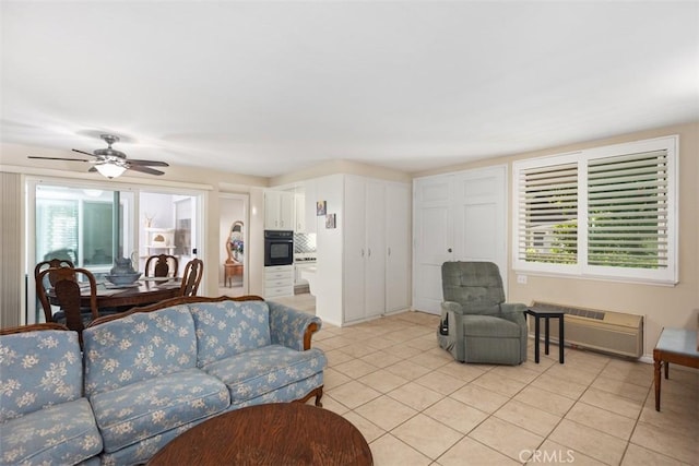 321 Avenida Carmel Unit H, Laguna Woods, CA 92637 - living room featuring ceiling fan and light tile patterned flooring