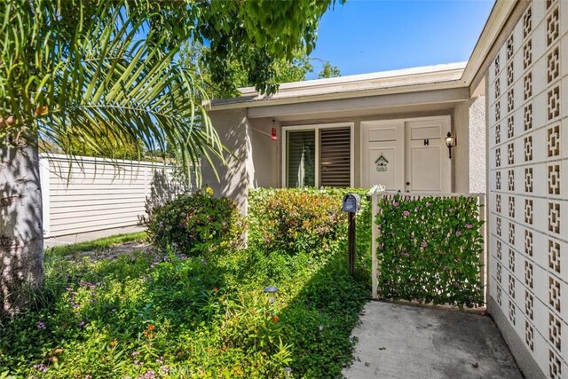 321 Avenida Carmel Unit H, Laguna Woods, CA 92637 - property entrance with stucco siding