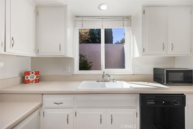 321 Avenida Carmel Unit H, Laguna Woods, CA 92637 - kitchen with white cabinets, dishwasher, and a sink