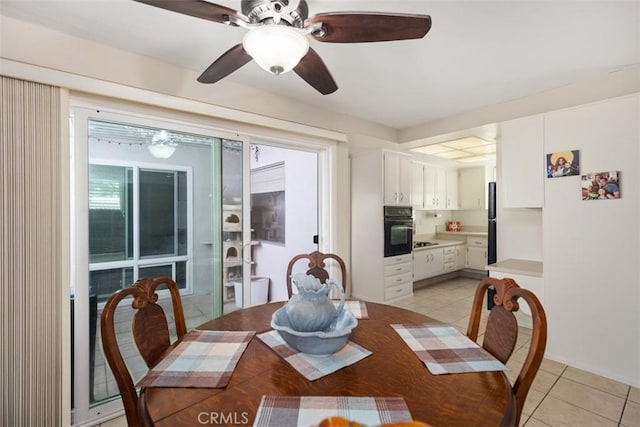 321 Avenida Carmel Unit H, Laguna Woods, CA 92637 - dining room with ceiling fan and light tile patterned floors