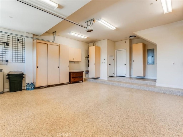garage featuring a garage door opener and electric panel