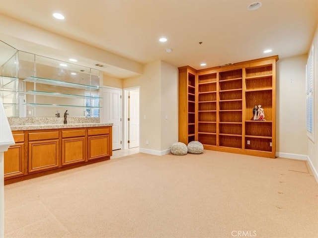 unfurnished room with light colored carpet, baseboards, and recessed lighting