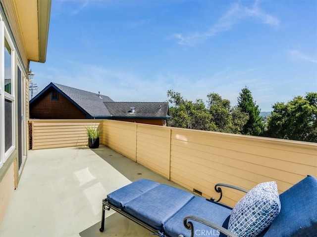view of patio featuring fence