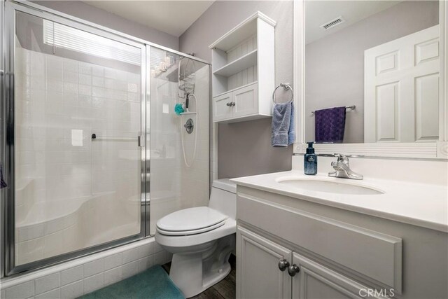 29465 Siderite Cir, Menifee, CA 92584 - bathroom with a shower stall, vanity, and toilet