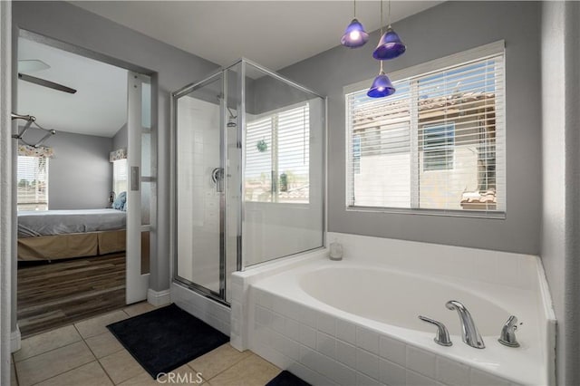 29465 Siderite Cir, Menifee, CA 92584 - ensuite bathroom featuring a bath, a stall shower, tile patterned flooring, and ceiling fan