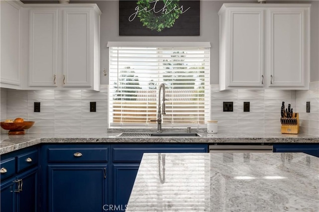29465 Siderite Cir, Menifee, CA 92584 - kitchen with blue cabinetry, a sink, white cabinetry, and backsplash