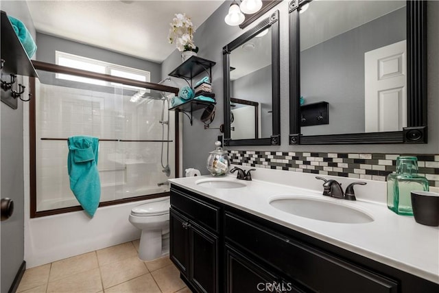 29465 Siderite Cir, Menifee, CA 92584 - full bathroom with toilet, bath / shower combo with glass door, double vanity, backsplash, and tile patterned flooring