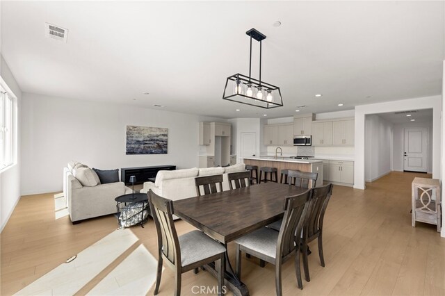 dining space featuring visible vents, baseboards, recessed lighting, and light wood-style floors